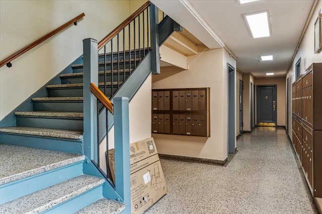 62-15 53rd Ave Unit Lgd, Maspeth, NY 11378 - staircase with mail area, speckled floor, and baseboards