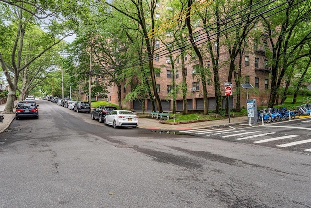 62-15 53rd Ave Unit Lgd, Maspeth, NY 11378 - view of asphalt road with sidewalks, curbs, and traffic signs