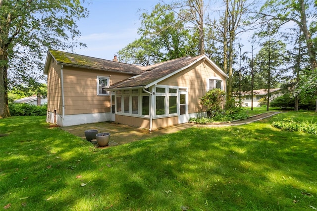 7 Cobblestone Ln, Cortlandt Manor, NY 10567 - rear view of property with a sunroom, a yard, and a chimney