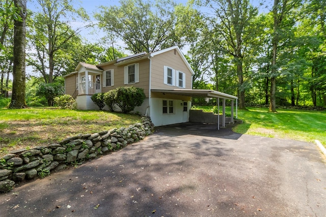 7 Cobblestone Ln, Cortlandt Manor, NY 10567 - view of front of house with a front lawn, driveway, and a carport