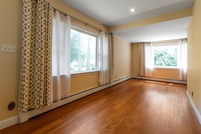 7 Cobblestone Ln, Cortlandt Manor, NY 10567 - spare room featuring hardwood / wood-style floors, baseboard heating, and recessed lighting