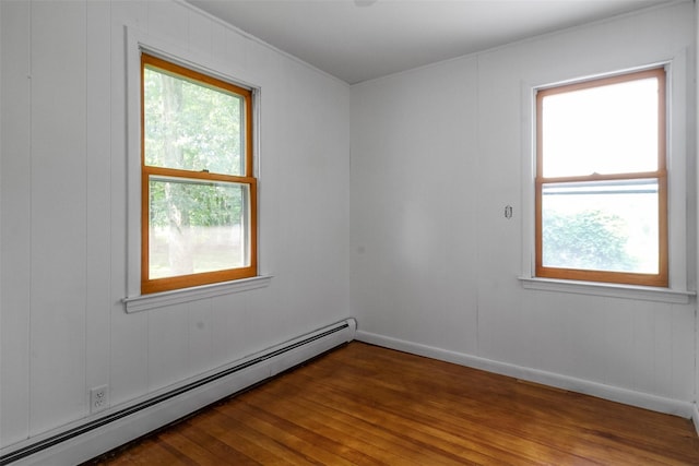 7 Cobblestone Ln, Cortlandt Manor, NY 10567 - spare room with a baseboard heating unit and wood finished floors