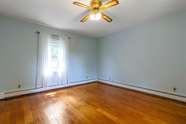 7 Cobblestone Ln, Cortlandt Manor, NY 10567 - unfurnished room featuring wood finished floors, a ceiling fan, and a baseboard heating unit