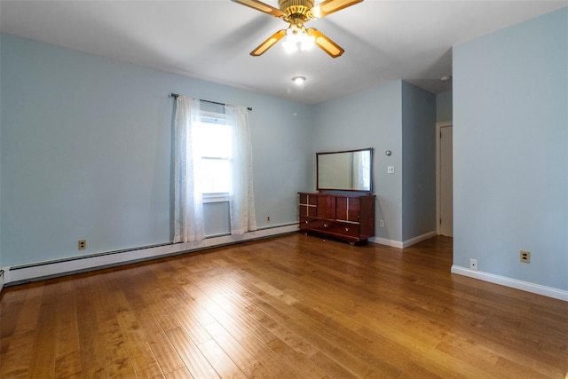 7 Cobblestone Ln, Cortlandt Manor, NY 10567 - unfurnished room with a baseboard radiator, wood finished floors, and a ceiling fan