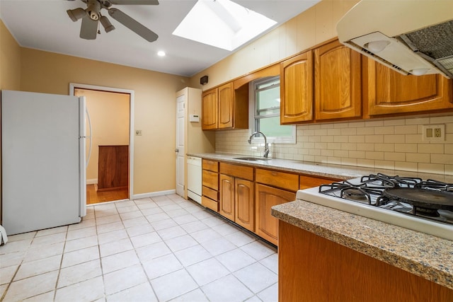 7 Cobblestone Ln, Cortlandt Manor, NY 10567 - kitchen with white appliances, range hood, a skylight, ceiling fan, and decorative backsplash