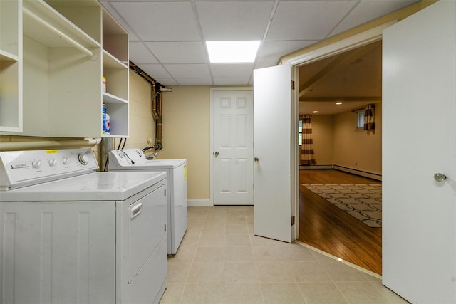 7 Cobblestone Ln, Cortlandt Manor, NY 10567 - laundry area with washing machine and dryer, baseboard heating, and light tile patterned floors