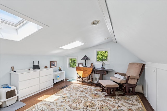 264 Washington Ave, Jamesport, NY 11947 - living area with a skylight, wood finished floors, and vaulted ceiling