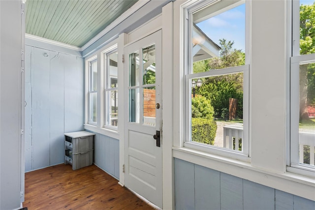 264 Washington Ave, Jamesport, NY 11947 - doorway to outside with dark wood-type flooring and ornamental molding