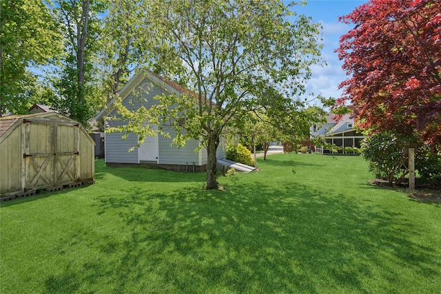 264 Washington Ave, Jamesport, NY 11947 - view of grassy yard with a storage unit
