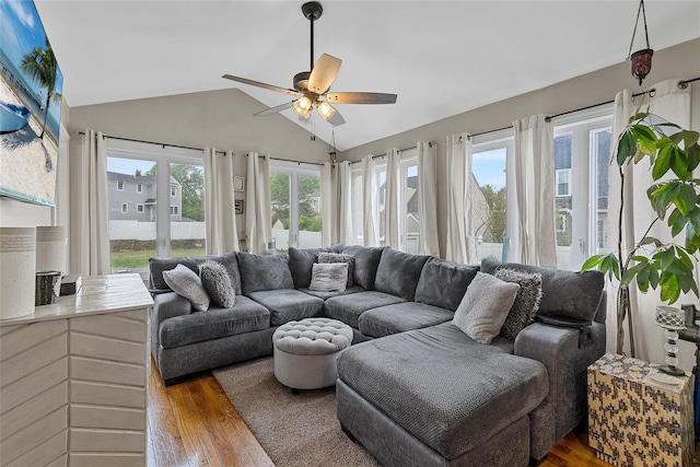 sunroom / solarium featuring french doors, plenty of natural light, and lofted ceiling