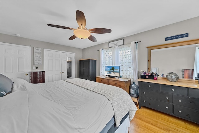 bedroom featuring light wood-style flooring and a ceiling fan