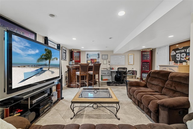 living room featuring a bar and recessed lighting