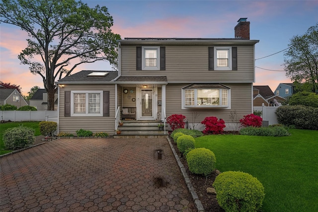 view of front of home featuring a chimney