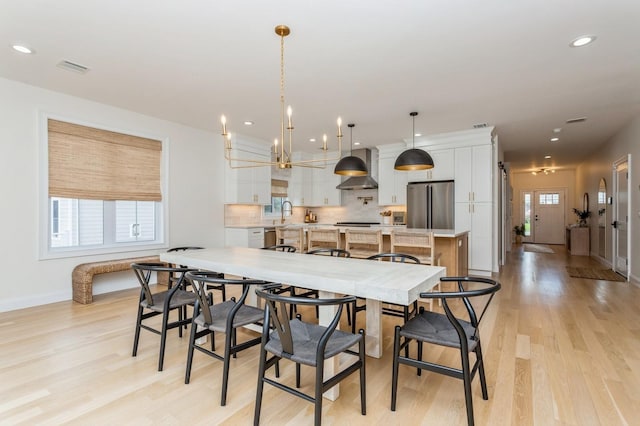 4 Haring Ave, Sparkill, NY 10976 - dining area featuring light wood finished floors, baseboards, recessed lighting, and a chandelier