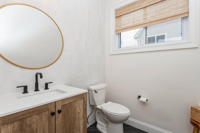 4 Haring Ave, Sparkill, NY 10976 - half bathroom with vanity, tile walls, toilet, tile patterned floors, and baseboards