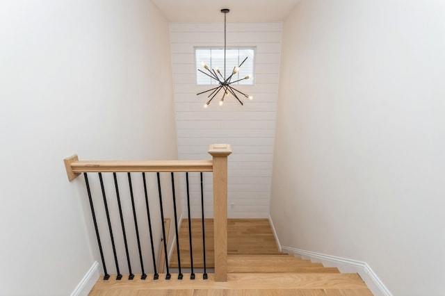 4 Haring Ave, Sparkill, NY 10976 - stairway featuring a chandelier, wood finished floors, and baseboards