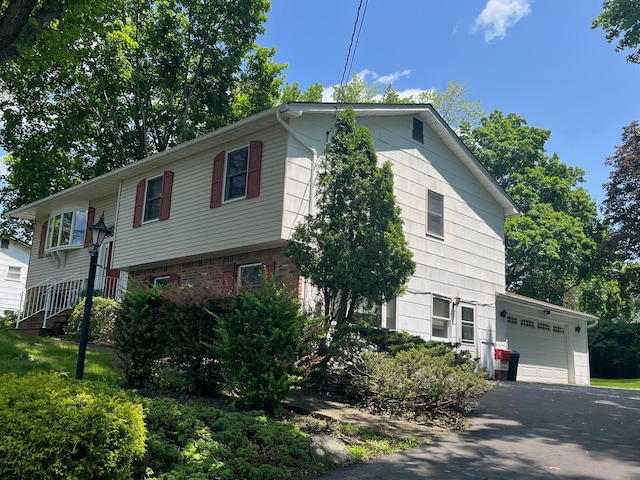 45 Princeton Dr, Tappan, NY 10983 - view of side of property with a garage and asphalt driveway