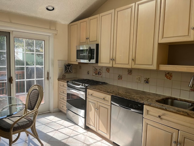 45 Princeton Dr, Tappan, NY 10983 - kitchen with stainless steel appliances, tasteful backsplash, a textured ceiling, light tile patterned floors, and lofted ceiling
