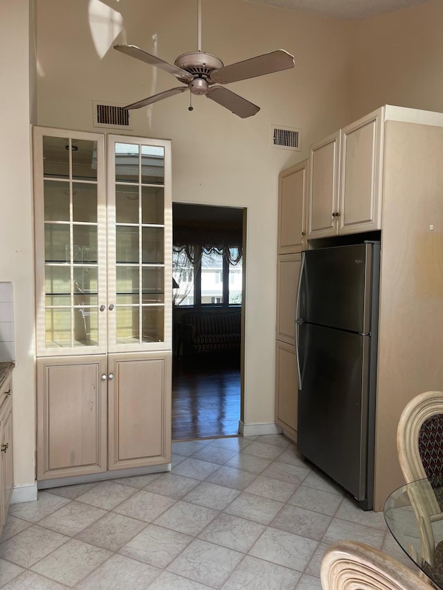 45 Princeton Dr, Tappan, NY 10983 - kitchen featuring freestanding refrigerator, ceiling fan, and a towering ceiling