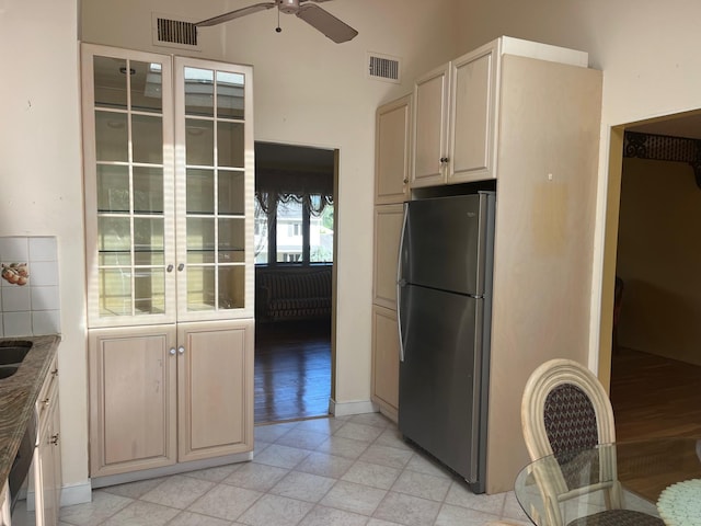 45 Princeton Dr, Tappan, NY 10983 - kitchen featuring freestanding refrigerator, a ceiling fan, stone counters, and a high ceiling