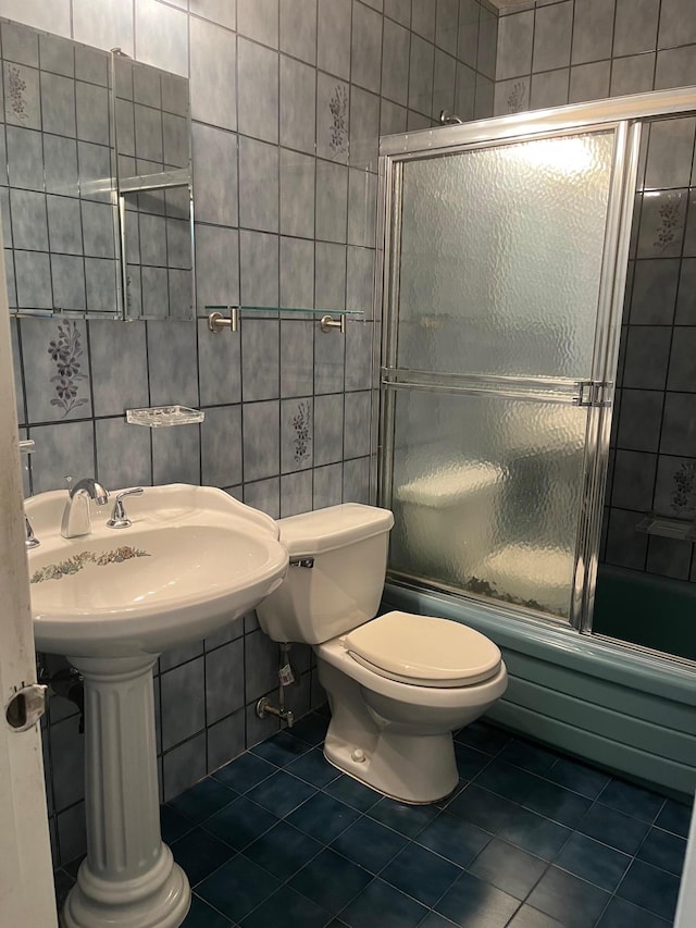45 Princeton Dr, Tappan, NY 10983 - bathroom featuring tile walls, tile patterned flooring, and bath / shower combo with glass door