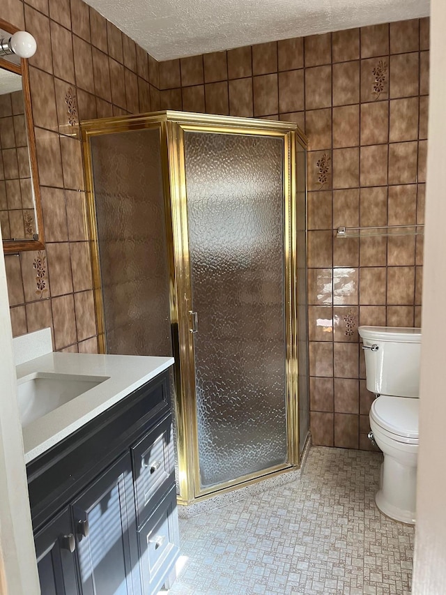 45 Princeton Dr, Tappan, NY 10983 - bathroom with tile walls, vanity, a shower stall, and a textured ceiling