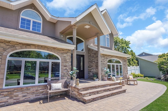 12 Barbera Rd, Commack, NY 11725 - entrance to property featuring stucco siding, stone siding, and a patio