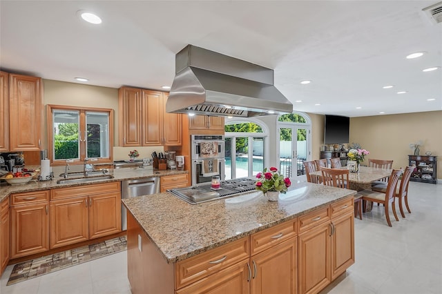 12 Barbera Rd, Commack, NY 11725 - kitchen with island exhaust hood, stainless steel appliances, light stone counters, a sink, and recessed lighting