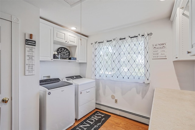 12 Barbera Rd, Commack, NY 11725 - laundry room with a baseboard heating unit, cabinet space, separate washer and dryer, light wood-style floors, and attic access
