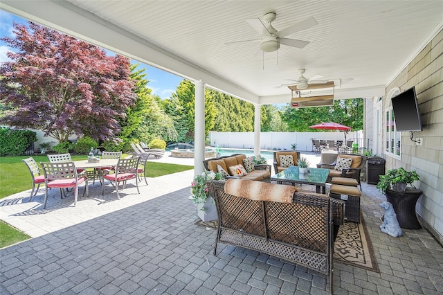 12 Barbera Rd, Commack, NY 11725 - fenced backyard with outdoor dining area, a patio area, a pool with connected hot tub, an outdoor hangout area, and ceiling fan