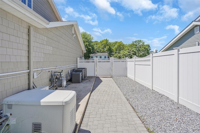 12 Barbera Rd, Commack, NY 11725 - fenced backyard with a gate and a patio