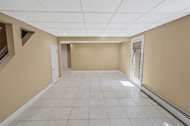 12 Barbera Rd, Commack, NY 11725 - empty room with a baseboard radiator, light tile patterned floors, a paneled ceiling, recessed lighting, and baseboards