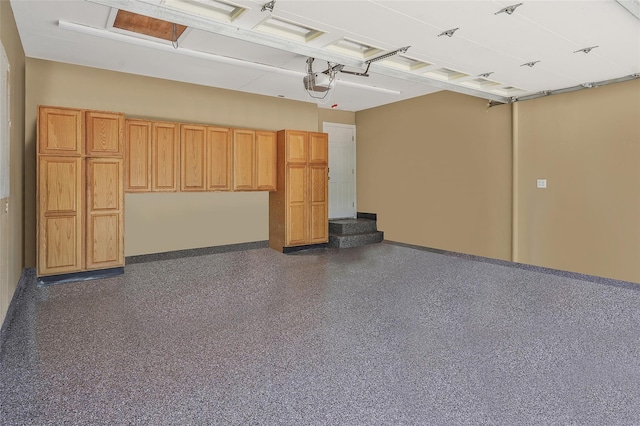 12 Barbera Rd, Commack, NY 11725 - garage featuring baseboards and a garage door opener
