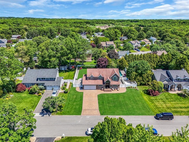 12 Barbera Rd, Commack, NY 11725 - aerial view of residential area with a heavily wooded area