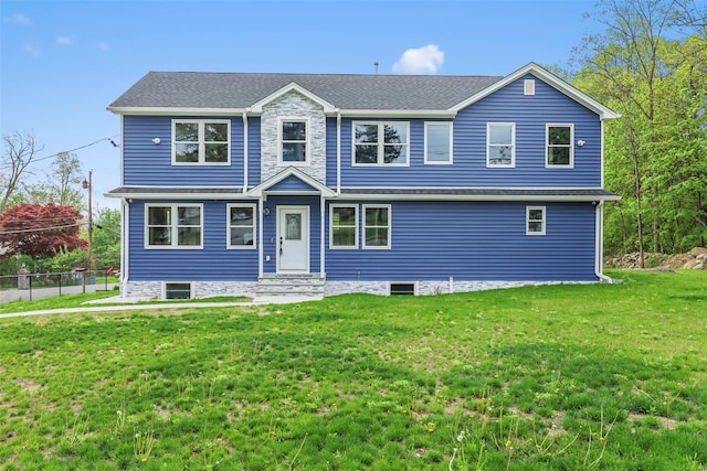 view of front of home with fence and a front yard