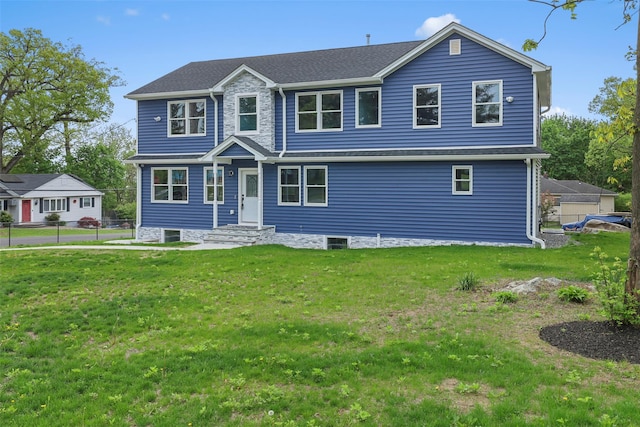 colonial house with a front lawn and fence