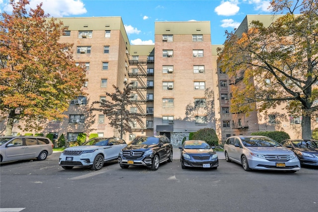 view of property featuring uncovered parking