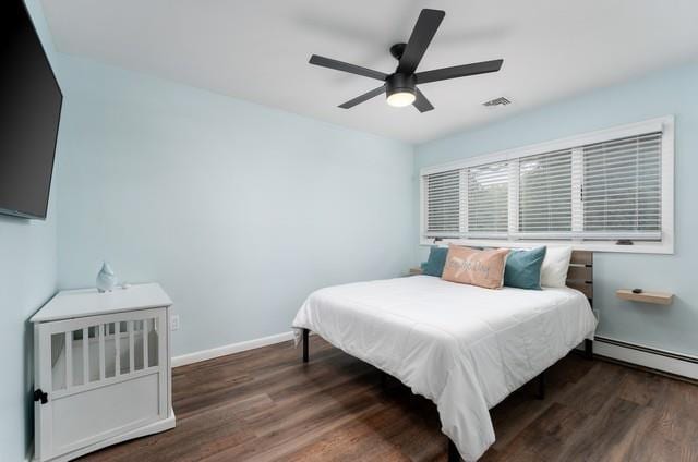 6 Circle Dr, Shoreham, NY 11786 - bedroom featuring wood finished floors, baseboard heating, and a ceiling fan