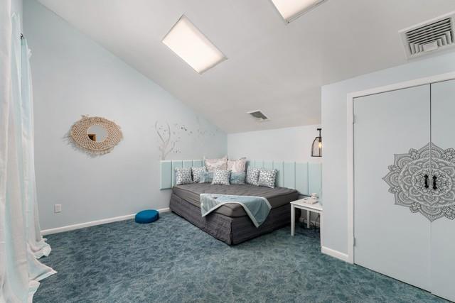 6 Circle Dr, Shoreham, NY 11786 - carpeted bedroom featuring lofted ceiling and baseboards