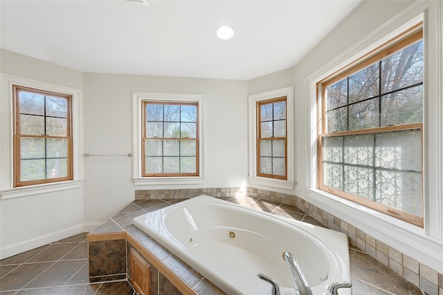 full bathroom featuring a jetted tub and tile patterned flooring