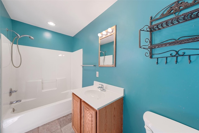 bathroom with vanity, toilet, shower / tub combination, and stone finish flooring