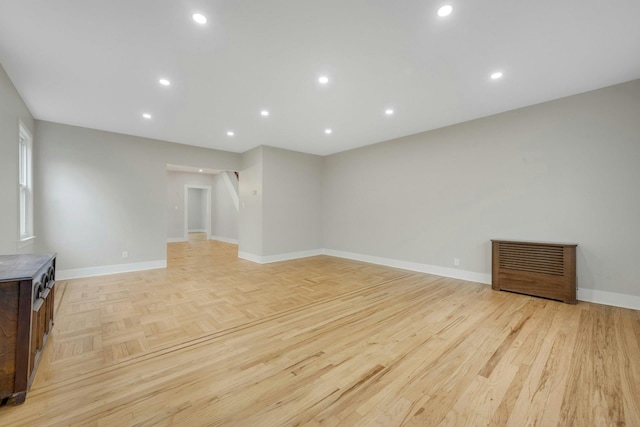 39 Crestmont Ave, Yonkers, NY 10704 - unfurnished living room with baseboards, parquet floors, and recessed lighting