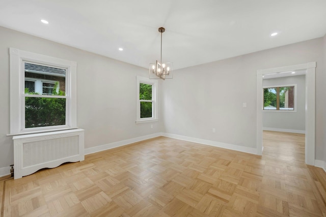39 Crestmont Ave, Yonkers, NY 10704 - empty room with radiator, plenty of natural light, baseboards, a chandelier, and recessed lighting