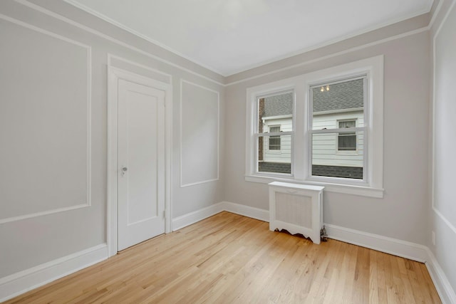 39 Crestmont Ave, Yonkers, NY 10704 - empty room featuring radiator, wood finished floors, ornamental molding, and baseboards