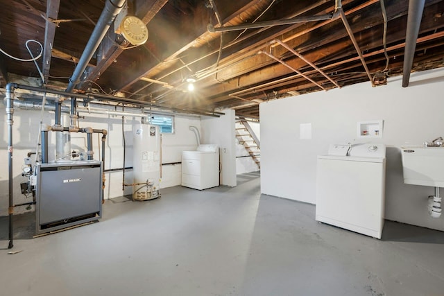 39 Crestmont Ave, Yonkers, NY 10704 - below grade area featuring water heater, washer and clothes dryer, stairway, a heating unit, and a sink