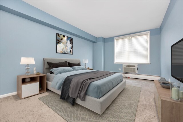 40 Daley Pl Unit 230, Lynbrook, NY 11563 - carpeted bedroom featuring an AC wall unit and a baseboard radiator
