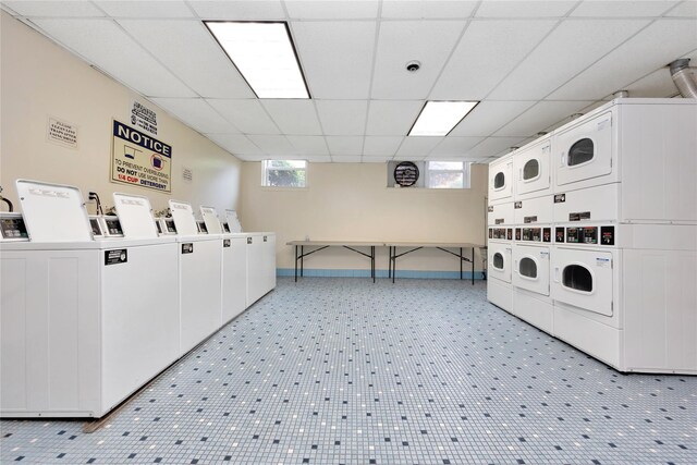 40 Daley Pl Unit 230, Lynbrook, NY 11563 - shared laundry room featuring stacked washer / dryer, independent washer and dryer, and baseboards