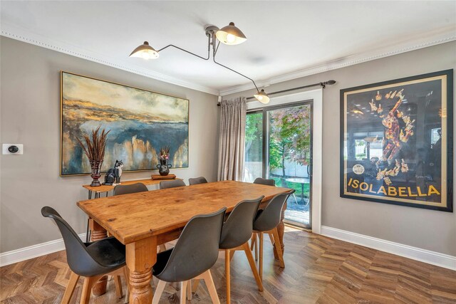 dining area featuring baseboards and crown molding