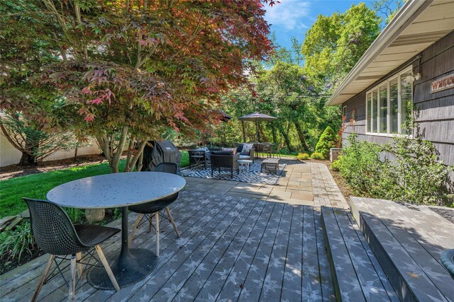 deck with outdoor dining area