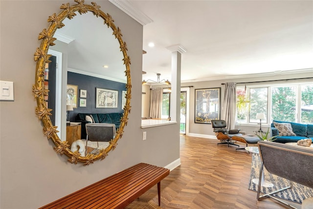 living area featuring baseboards, ornamental molding, and recessed lighting